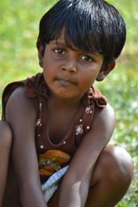 A little girl playing outside the temple in Kandy