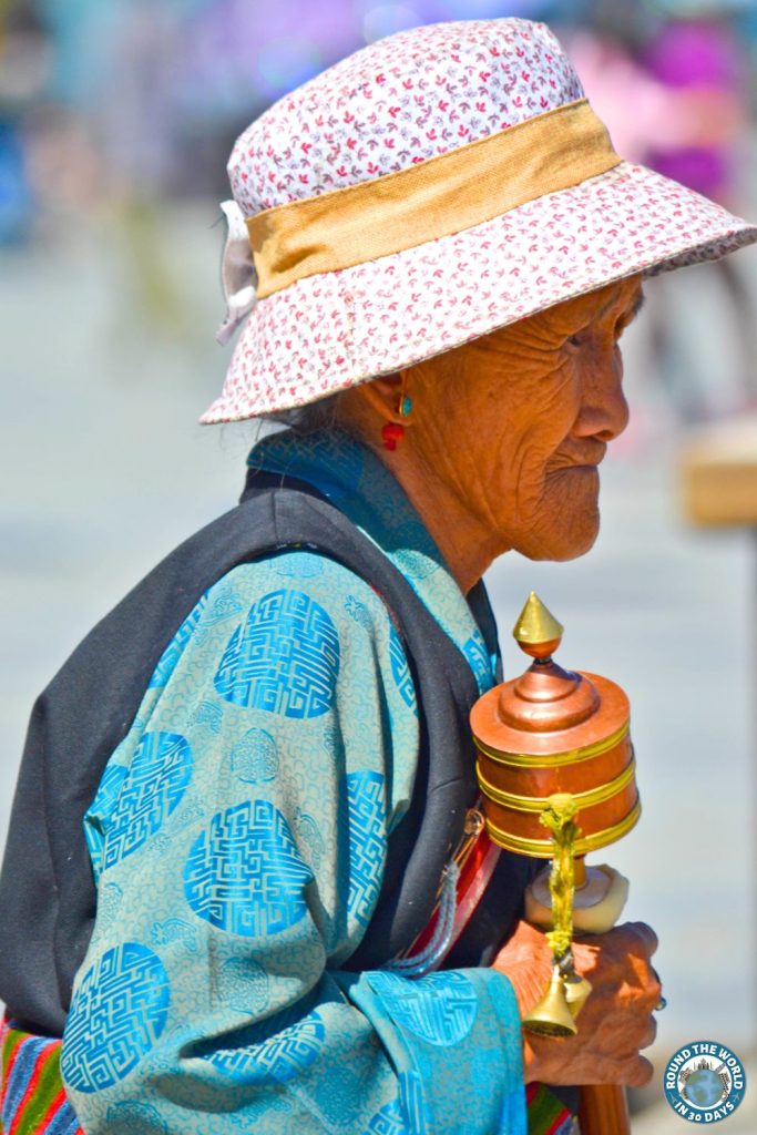 Tibetan Woman with Prayer Wheel