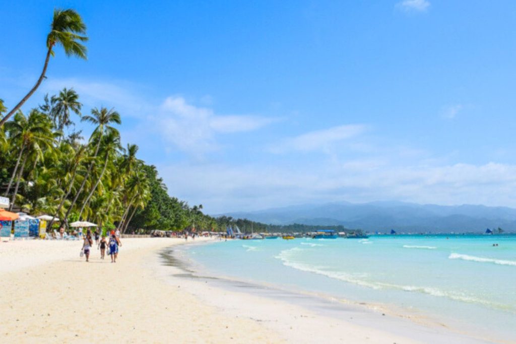 White sand beach with palm trees Boracay Philippines