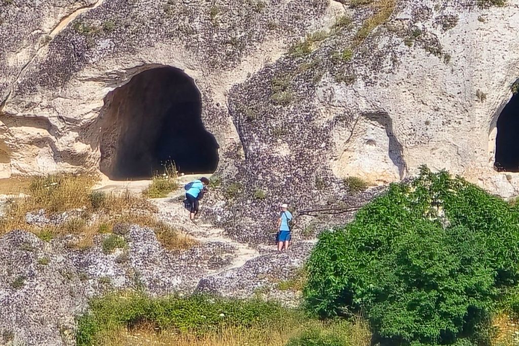 People Exploring the Caves of Matera Italy